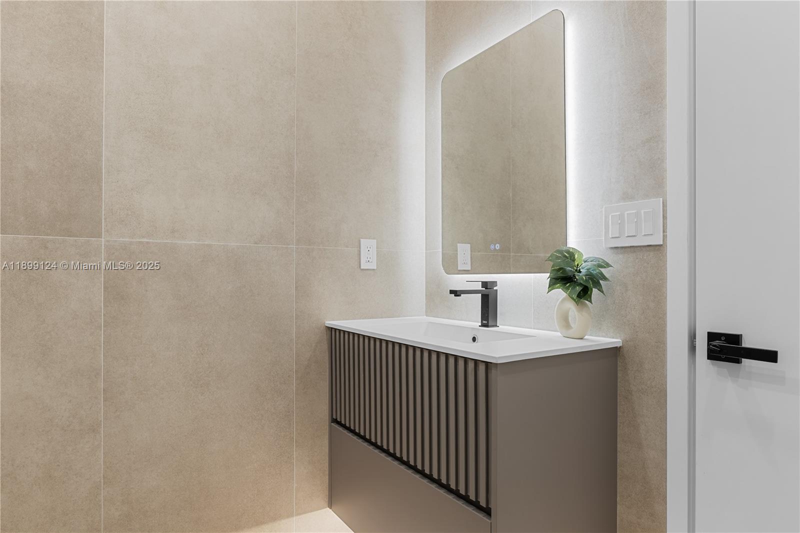 2823 Southwest 23rd Terrace, Unit 2823 Miami, FL 33145 - Photo 20 of 32 a bathroom with a sink and a mirror