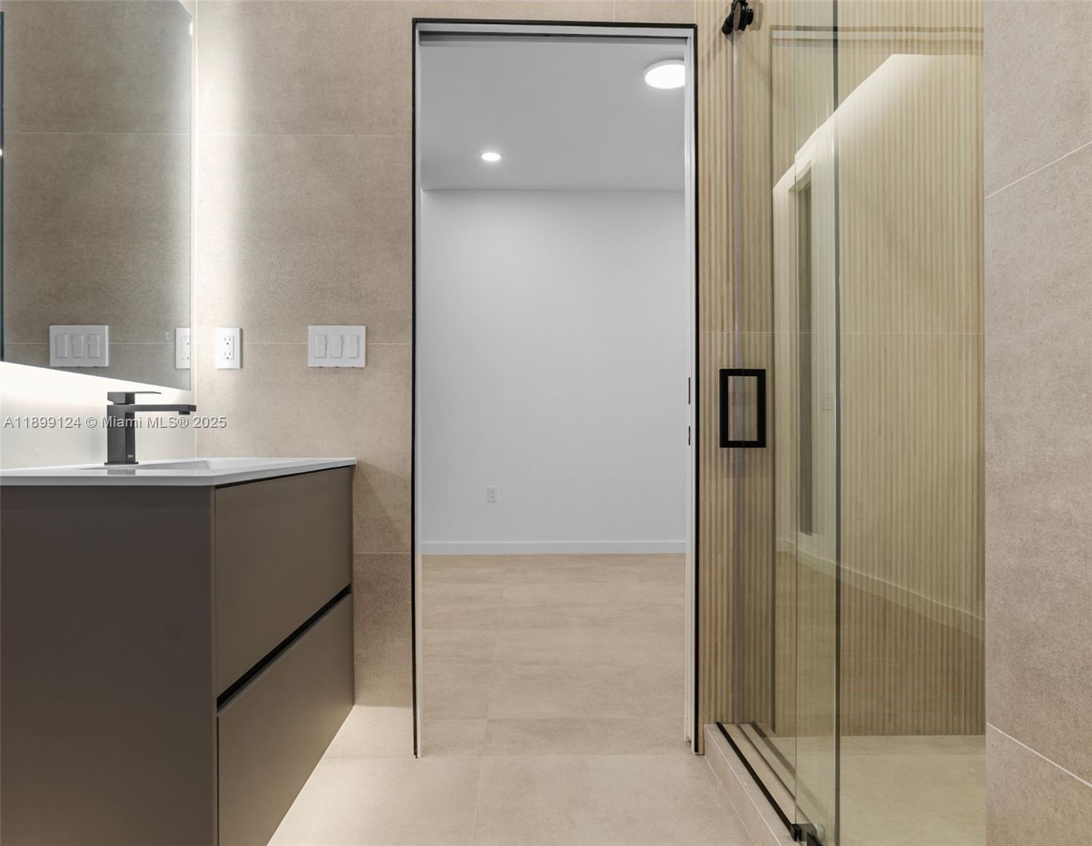 2823 Southwest 23rd Terrace, Unit 2823 Miami, FL 33145 - Photo 21 of 32 a bathroom with a shower and a sink