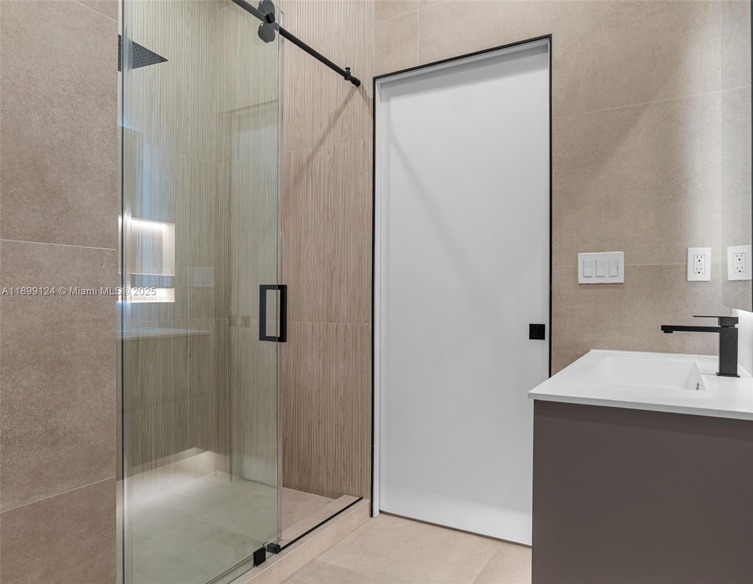 2823 Southwest 23rd Terrace, Unit 2823 Miami, FL 33145 - Photo 22 of 32 a bathroom with a shower and a sink