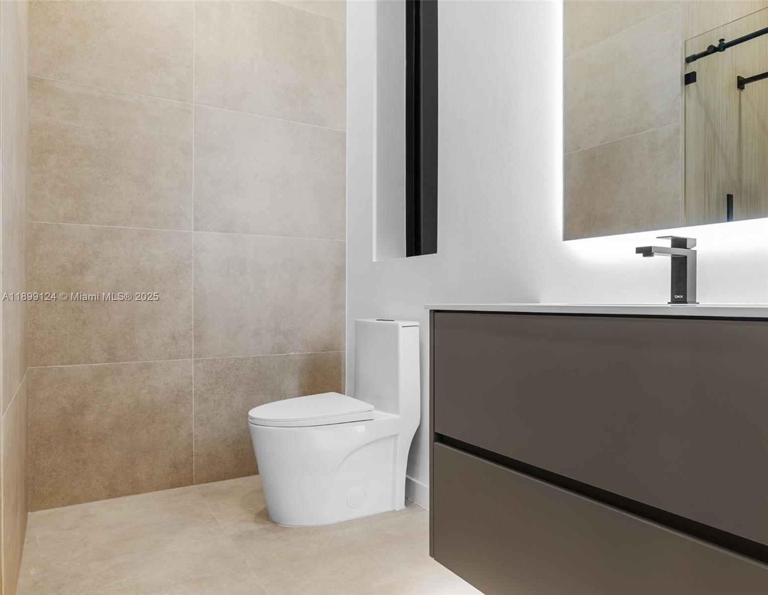 2823 Southwest 23rd Terrace, Unit 2823 Miami, FL 33145 - Photo 23 of 32 a bathroom with a sink a toilet a mirror and shower