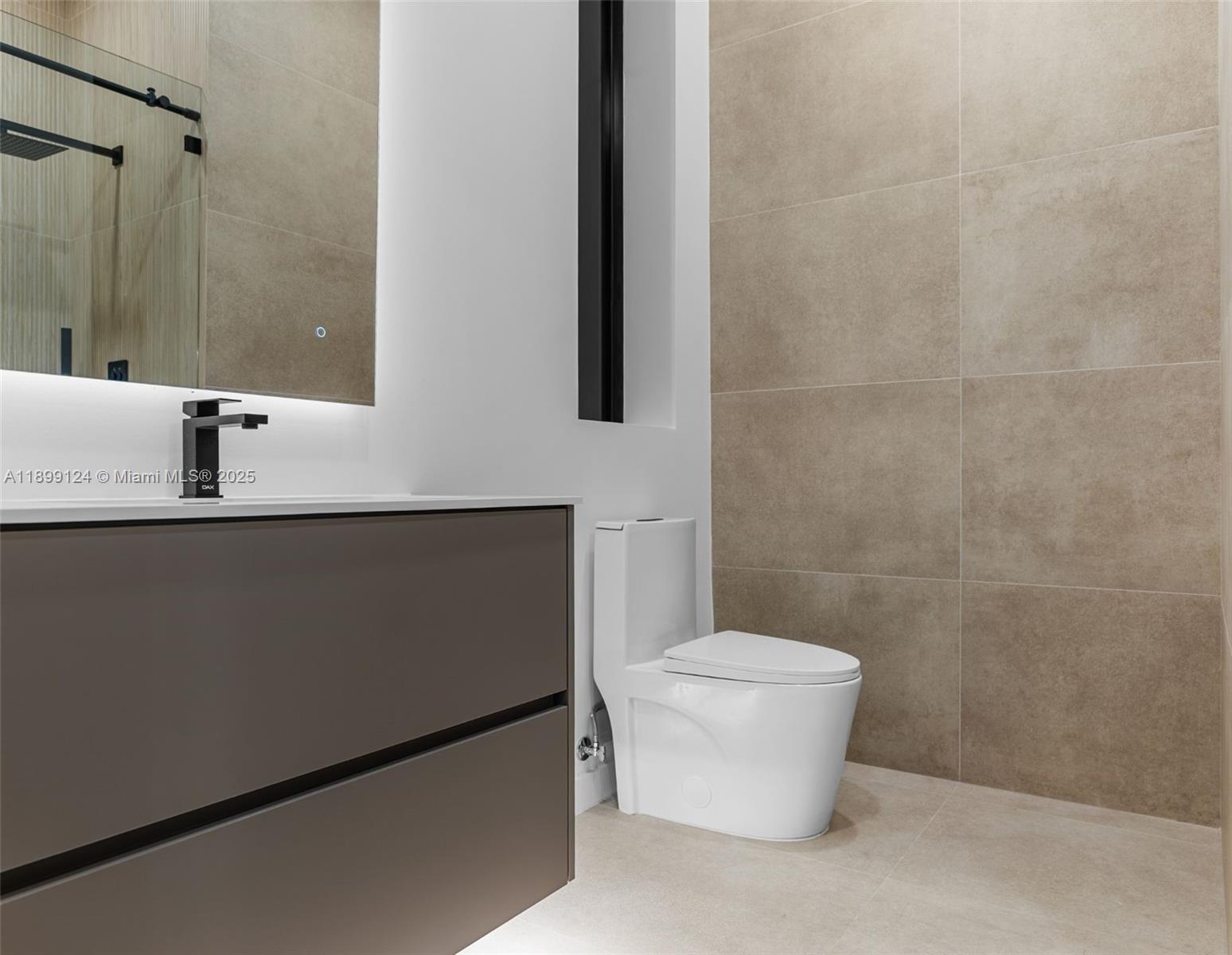 2823 Southwest 23rd Terrace, Unit 2823 Miami, FL 33145 - Photo 24 of 32 a bathroom with a sink a toilet and mirror