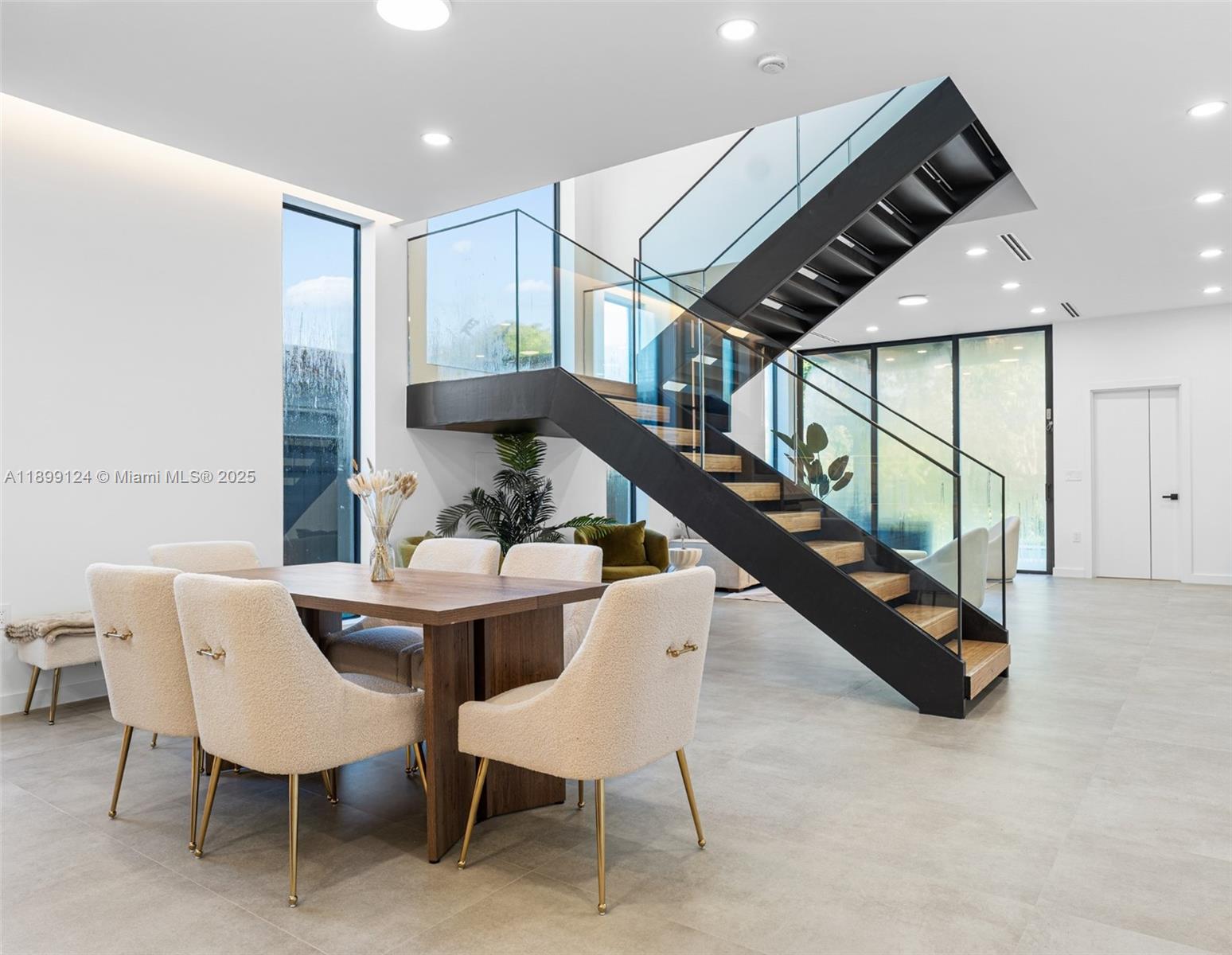 2823 Southwest 23rd Terrace, Unit 2823 Miami, FL 33145 - Photo 8 of 32 a dining room with furniture and stairs