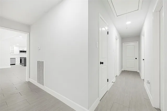 a bathroom with a sink a light fixture and a mirror