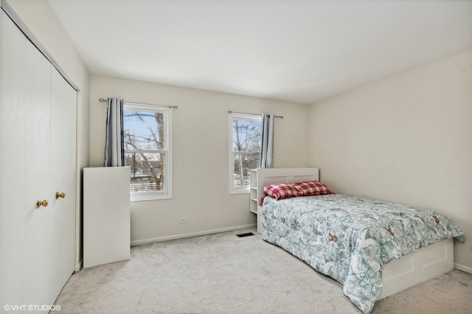 1101 Spring Creek Court Elgin, IL 60120 - Photo 17 of 18 a bedroom with a bed and a cabinets