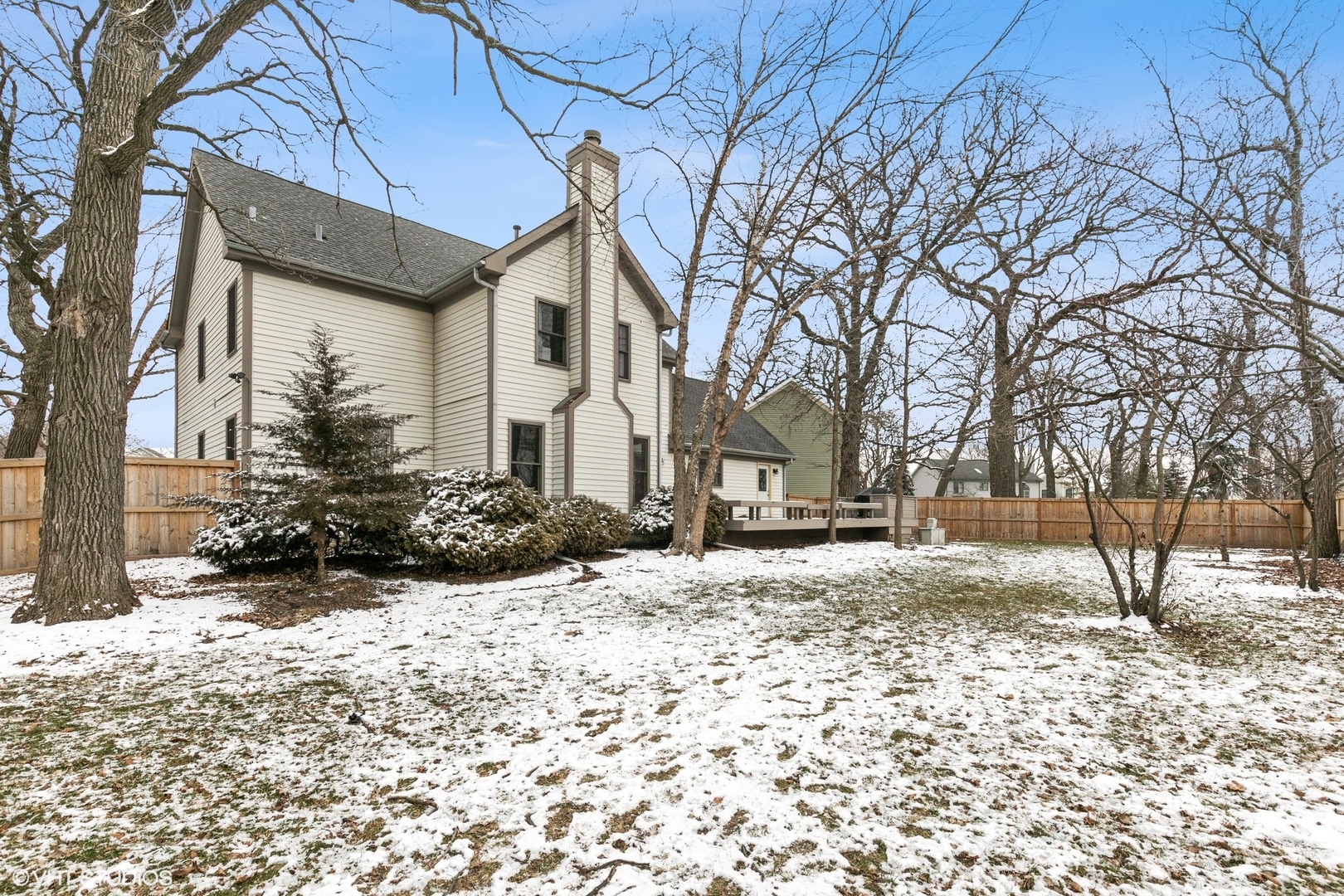 1101 Spring Creek Court Elgin, IL 60120 - Photo 18 of 18 a view of a house with a yard covered in snow