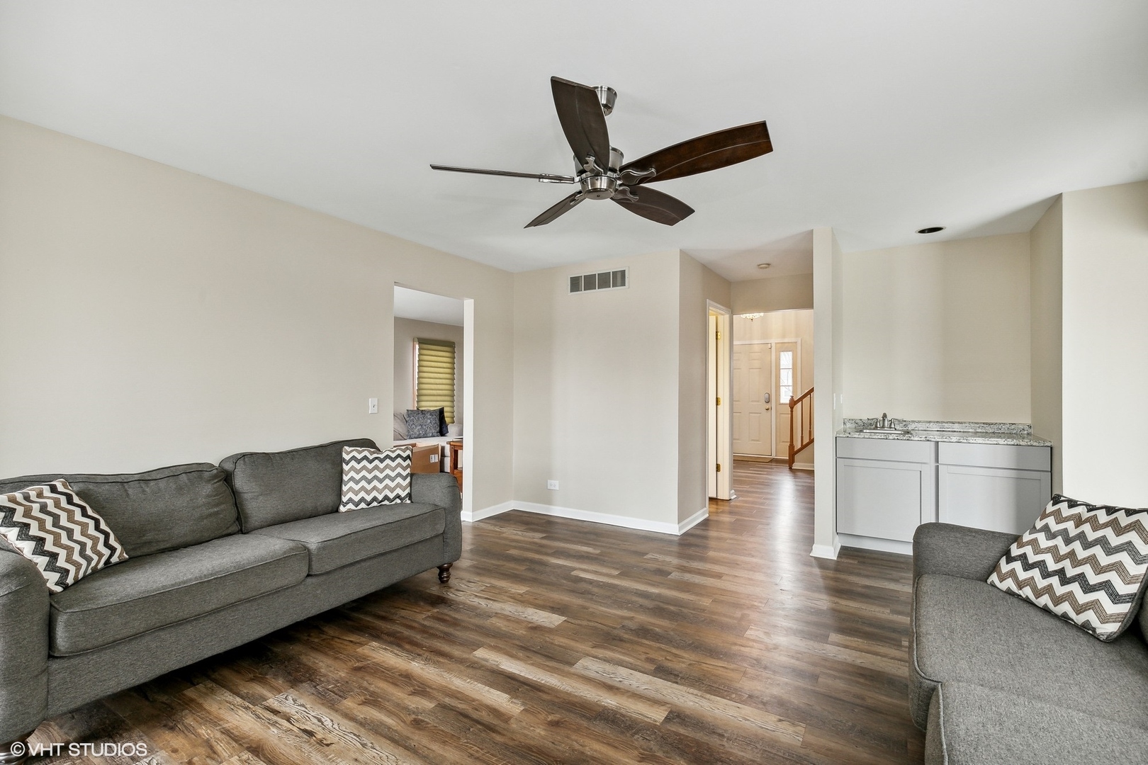 1101 Spring Creek Court Elgin, IL 60120 - Photo 4 of 18 a living room with furniture and a wooden floor
