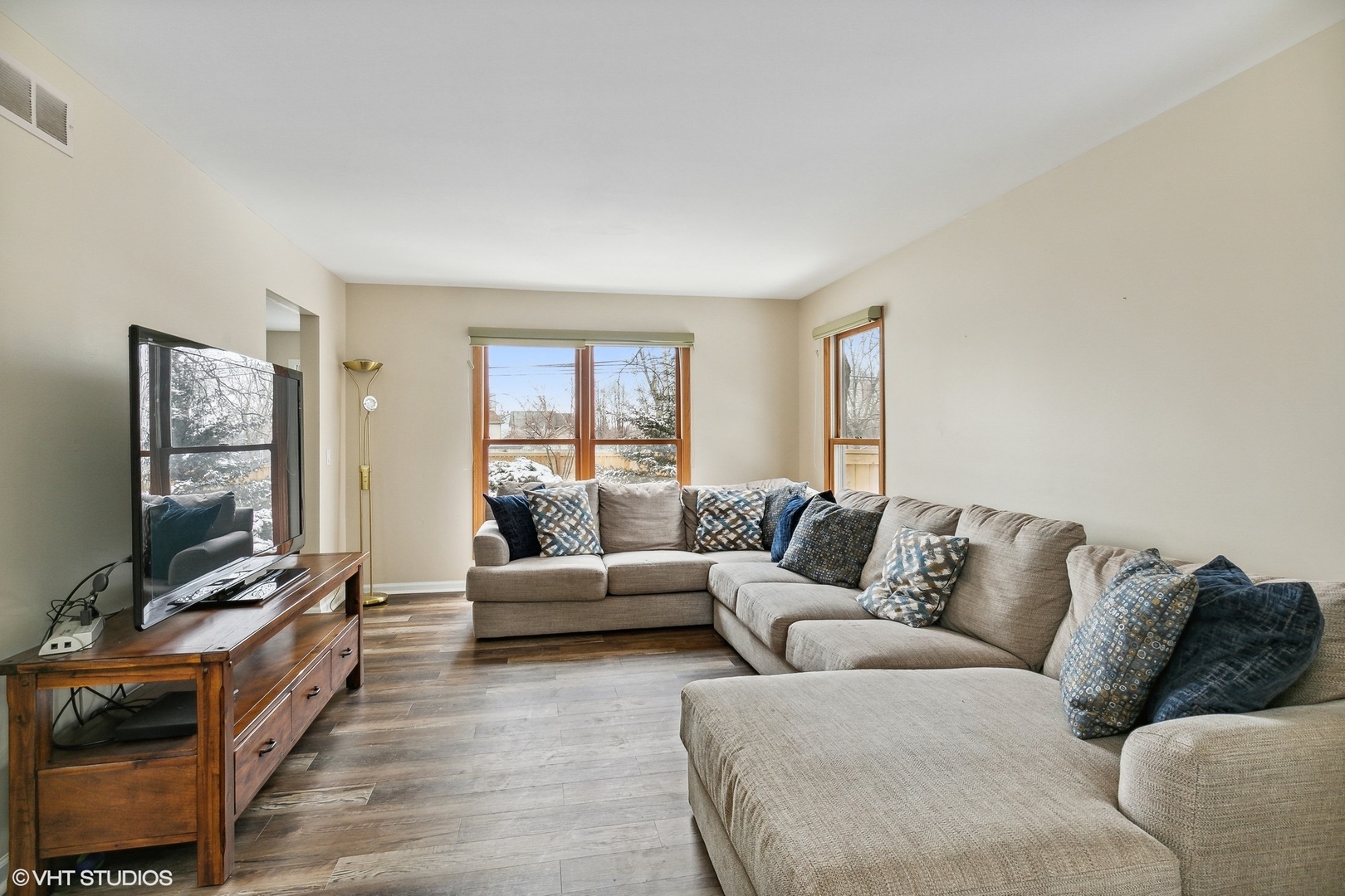 1101 Spring Creek Court Elgin, IL 60120 - Photo 5 of 18 a living room with furniture and a flat screen tv