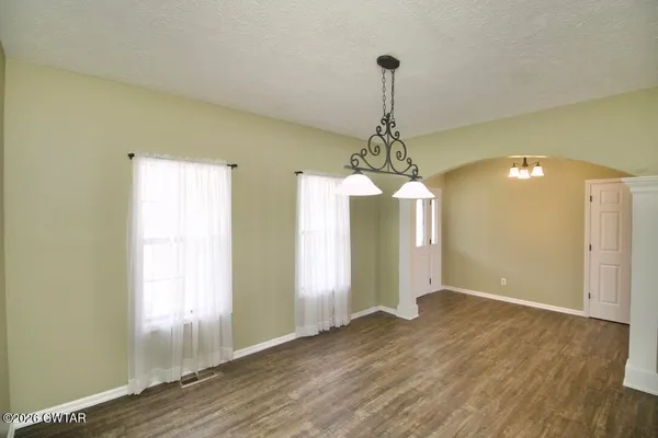 a kitchen with granite countertop a stove and a sink