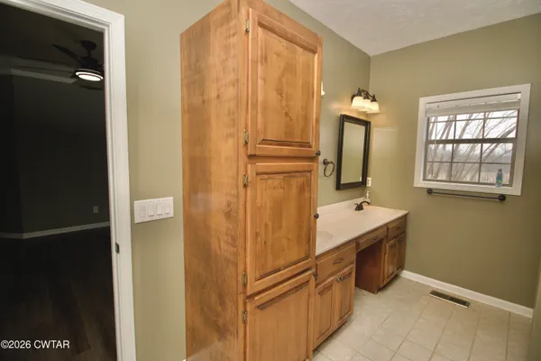 a view of swimming pool with lake and mountain in the back