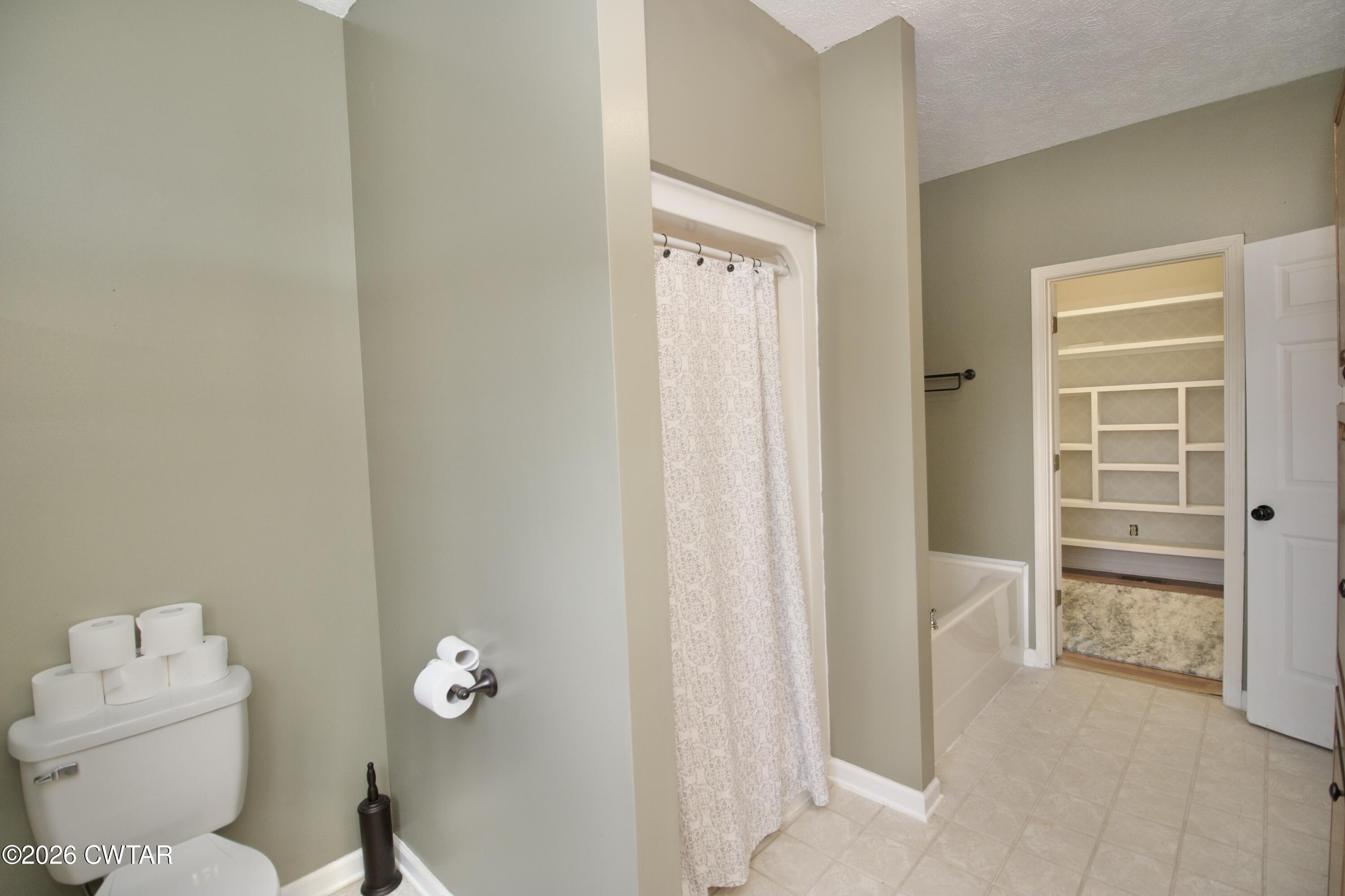 2845 Gilchrist Stantonville Road Stantonville, TN 38379 - Photo 34 of 97 a bathroom with a toilet and a shower