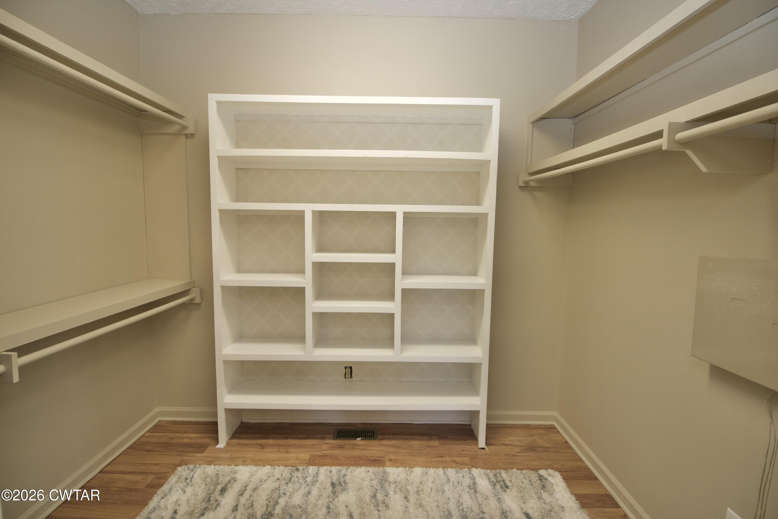 2845 Gilchrist Stantonville Road Stantonville, TN 38379 - Photo 37 of 97 a view of walk in closet with empty racks