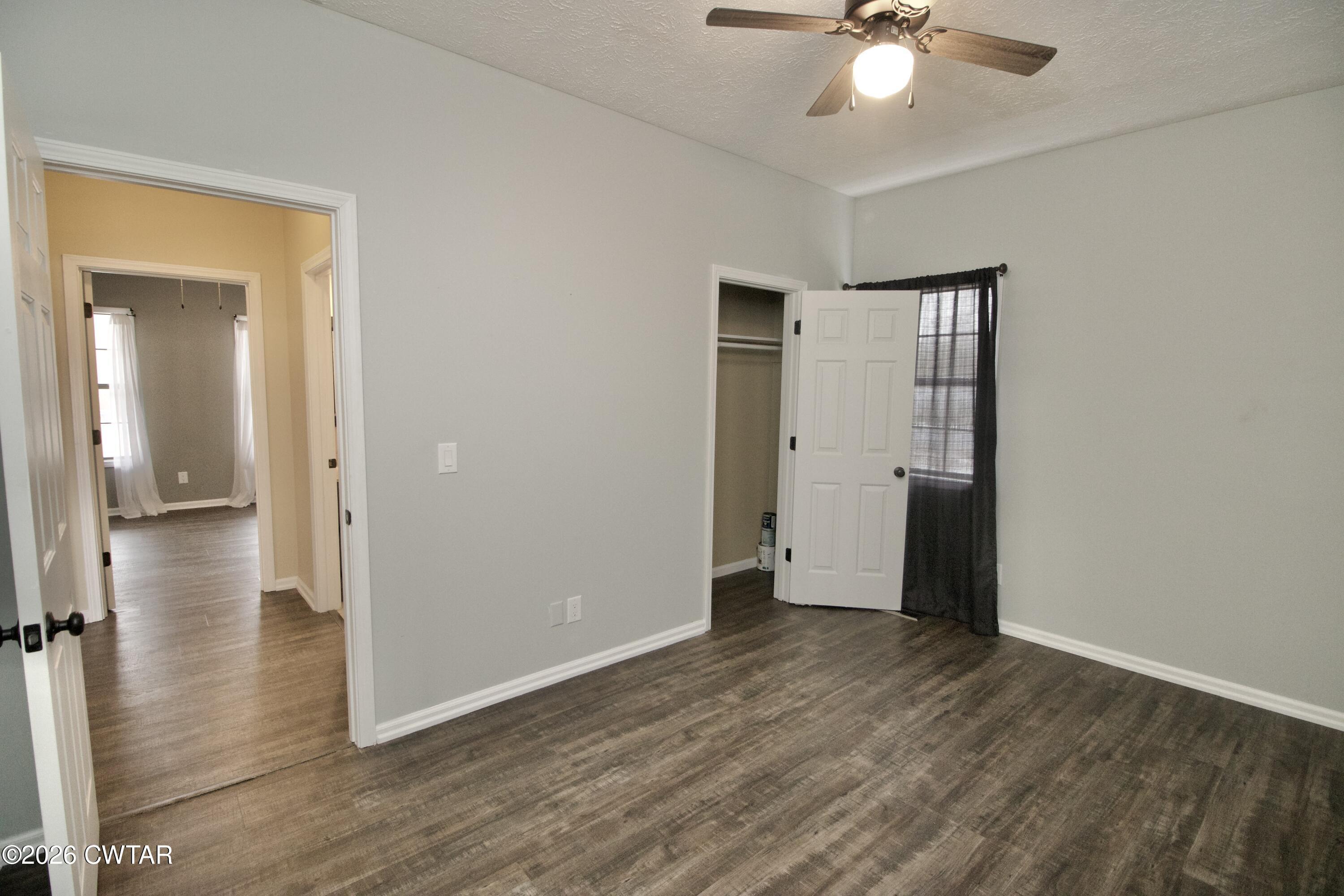 2845 Gilchrist Stantonville Road Stantonville, TN 38379 - Photo 40 of 97 wooden floor in an empty room with a window