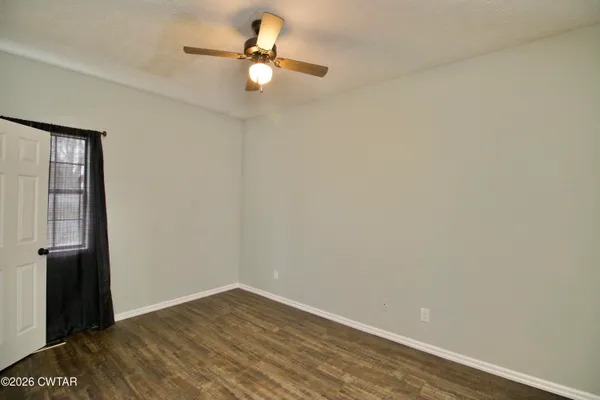 a view of a lake with houses in background