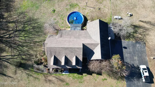 a view of a room with wooden floor chandelier and entryway