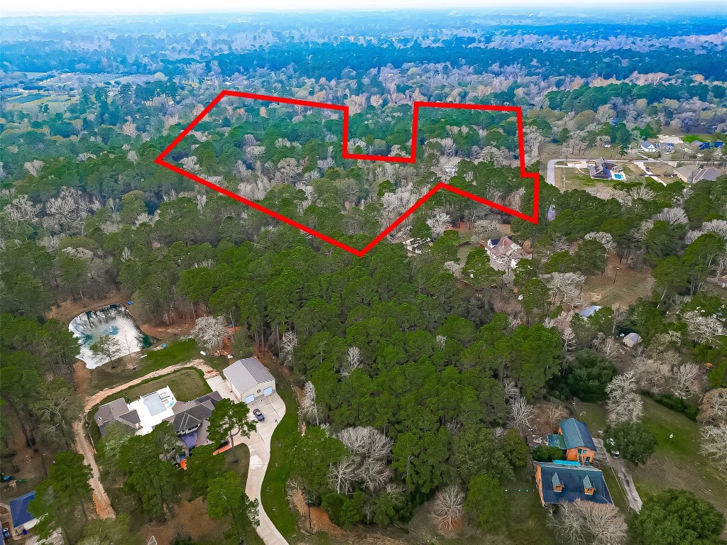 Aerial view highlighting the property boundaries, showcasing the expansive lot and surrounding neighborhood setting.