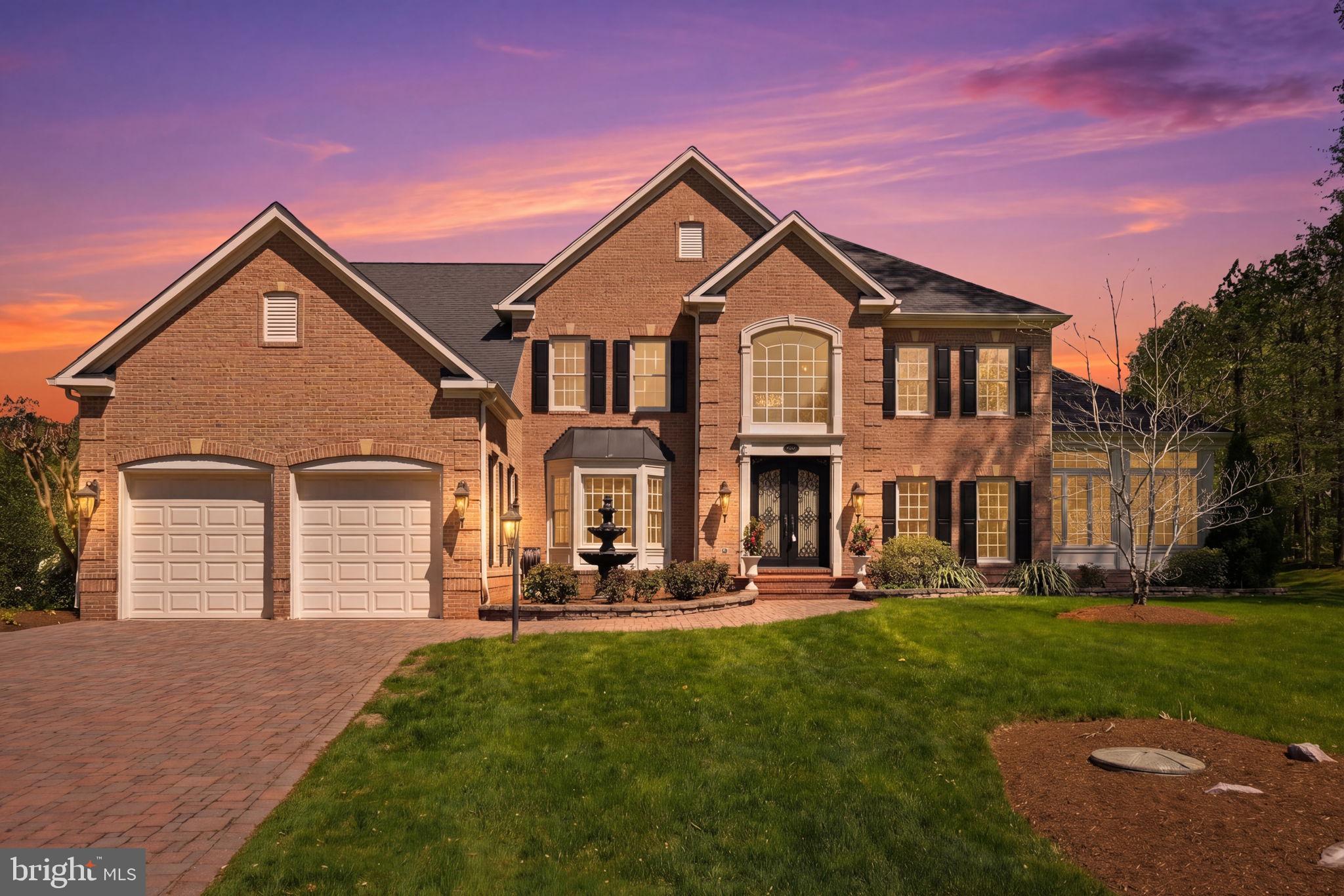 206 May Lane Edgewater, MD 21037 - Photo 1 of 66 Elegant brick home at sunset glow.