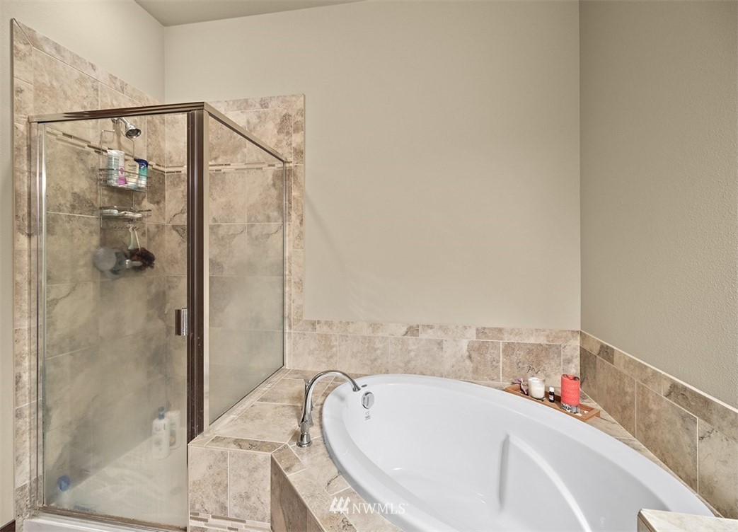 3813 Northeast 3rd Place Renton, WA 98056 - Photo 22 of 33 a bathroom with a tub and shower