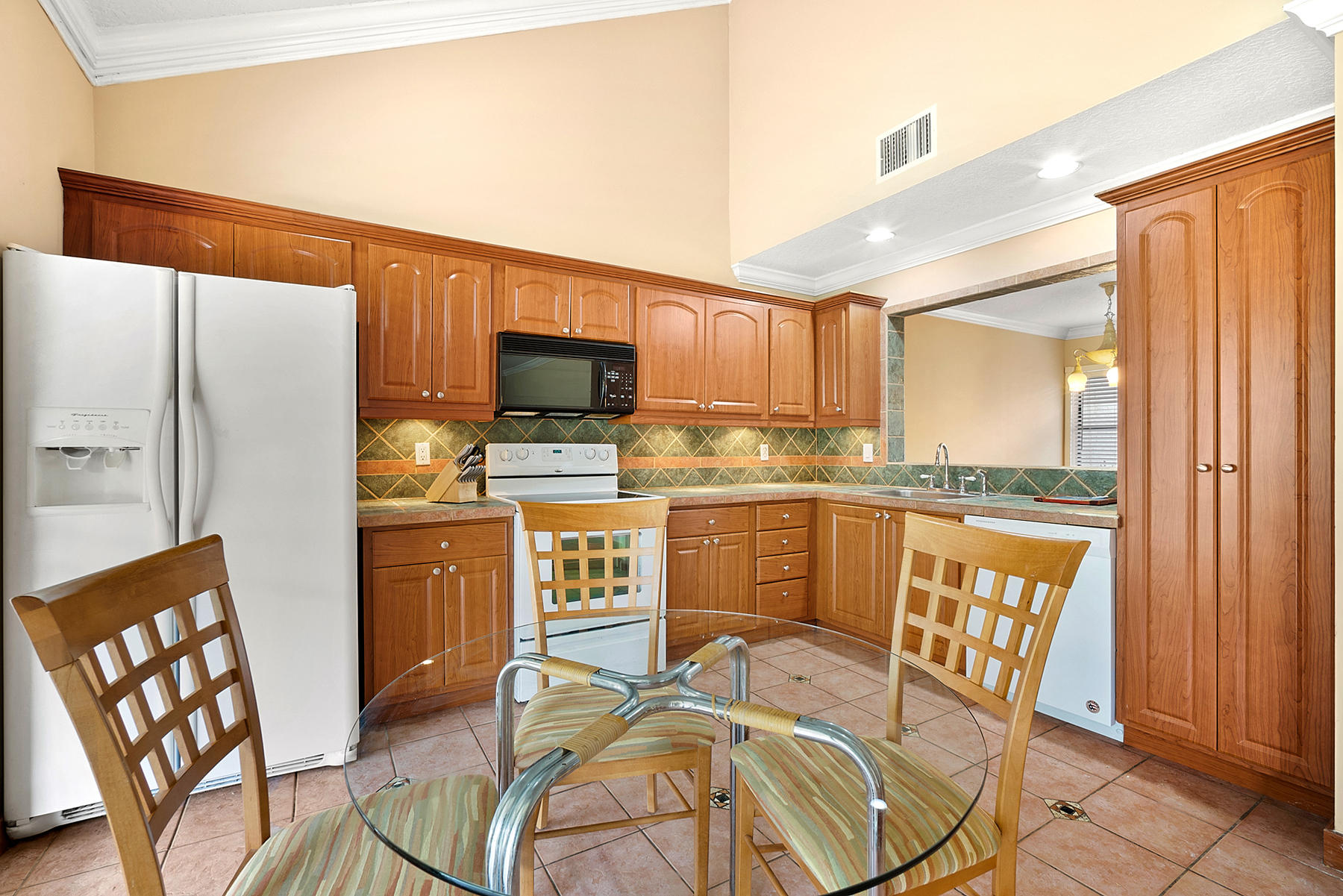 9350 Ketay Circle Boca Raton, FL 33428 - Photo 13 of 32 Kitchen w/ Pass Through to Dining Room