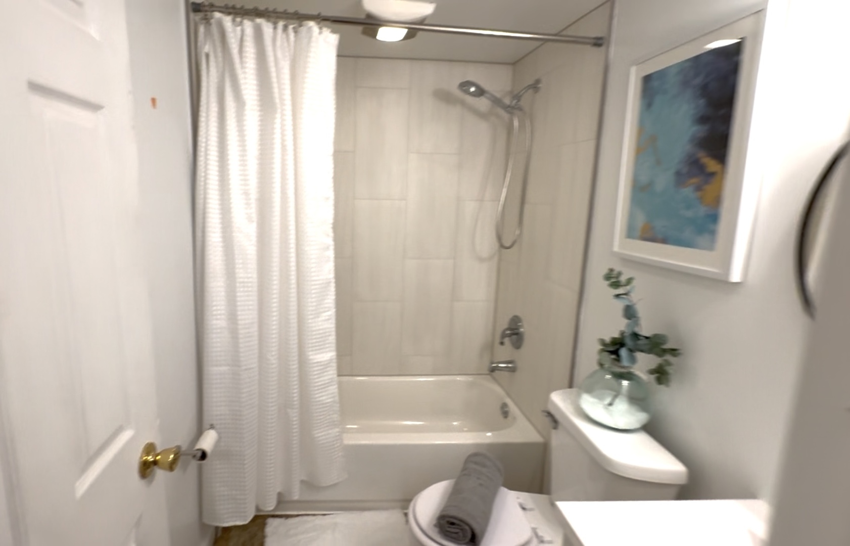116 North 9th Street DeKalb, IL 60115 - Photo 12 of 20 a bathroom with a sink a toilet a tub and shower
