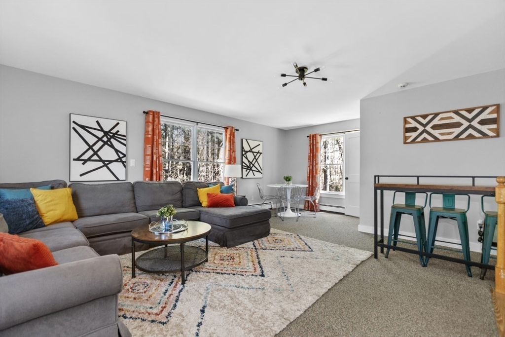 154 Topsfield Road Boxford, MA 01921 - Photo 11 of 39 a living room with furniture and a large window