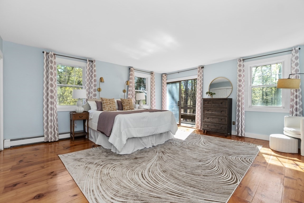 154 Topsfield Road Boxford, MA 01921 - Photo 12 of 39 a bed room with a bed and a chair