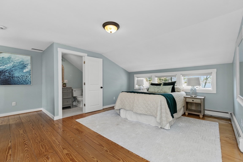 154 Topsfield Road Boxford, MA 01921 - Photo 16 of 39 a bedroom with a bed and wooden floor