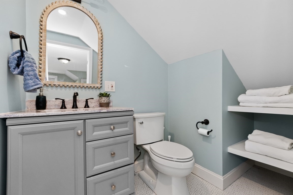 154 Topsfield Road Boxford, MA 01921 - Photo 18 of 39 a bathroom with a toilet sink and mirror