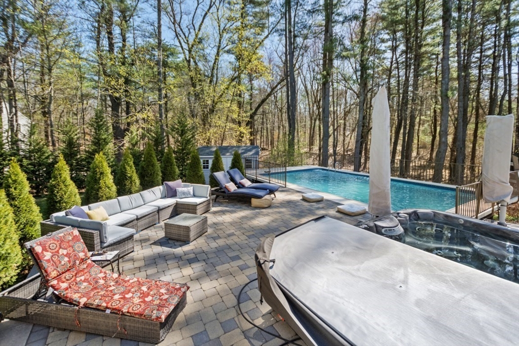 154 Topsfield Road Boxford, MA 01921 - Photo 19 of 39 a backyard of a house with table and chairs