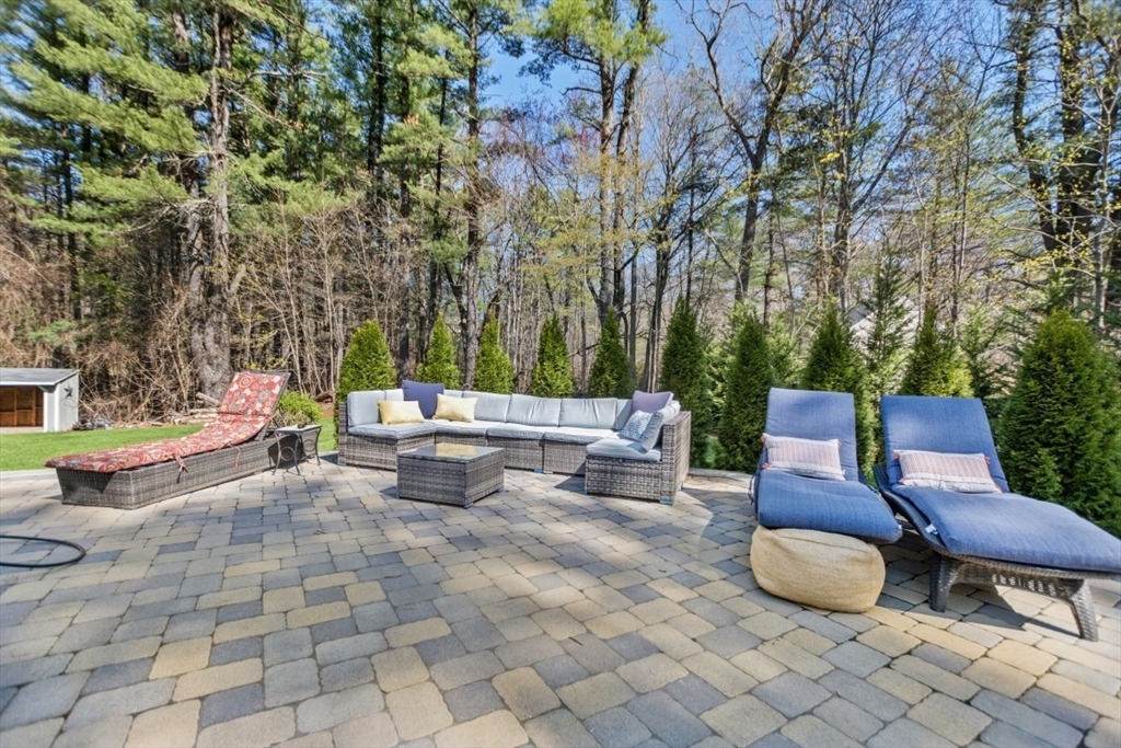 154 Topsfield Road Boxford, MA 01921 - Photo 21 of 39 a view of a patio with chairs and a potted plant