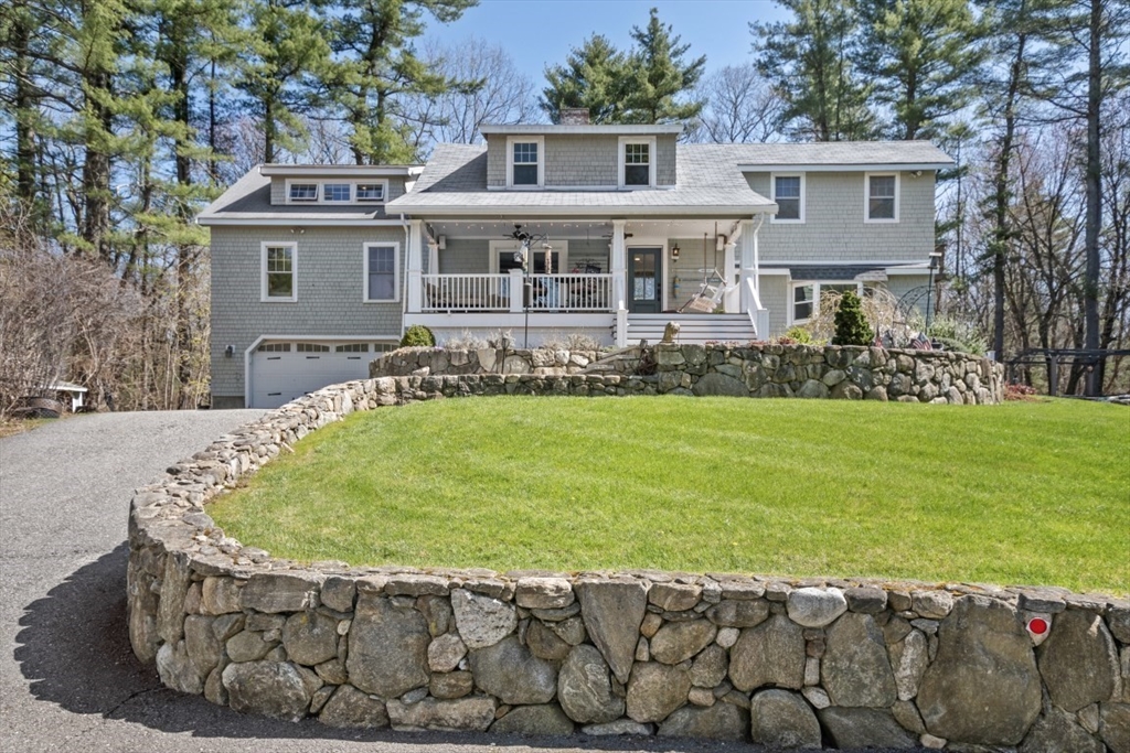 154 Topsfield Road Boxford, MA 01921 - Photo 28 of 39 a view of a house with a yard table and chairs