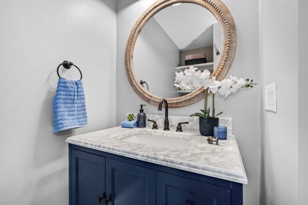 154 Topsfield Road Boxford, MA 01921 - Photo 8 of 39 a bathroom with a granite countertop sink and a mirror