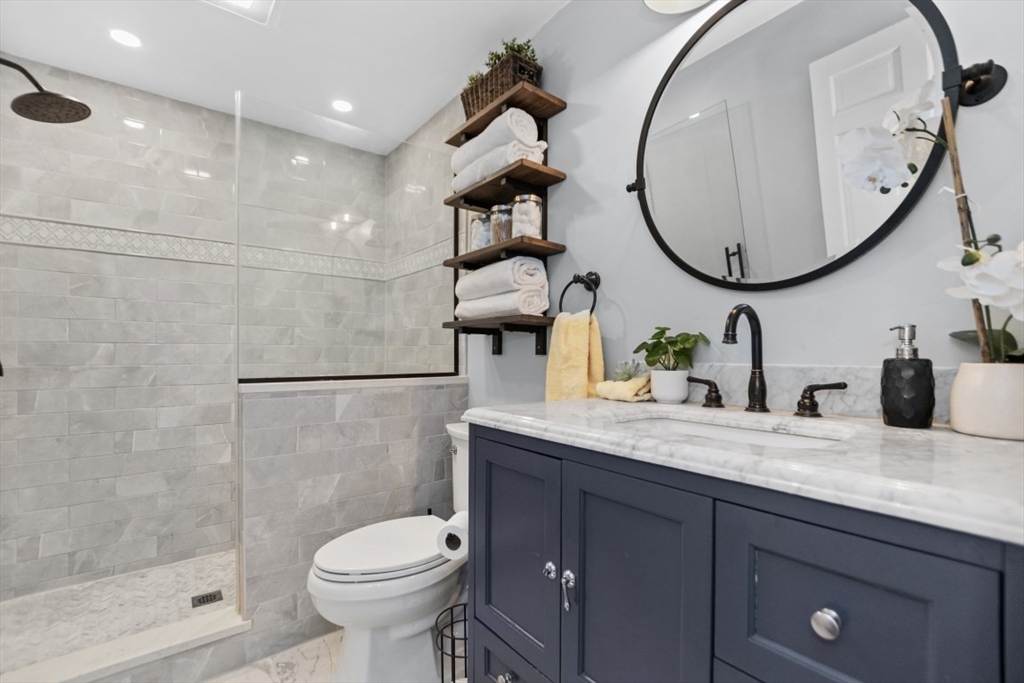 154 Topsfield Road Boxford, MA 01921 - Photo 10 of 39 a bathroom with a toilet a sink and a mirror
