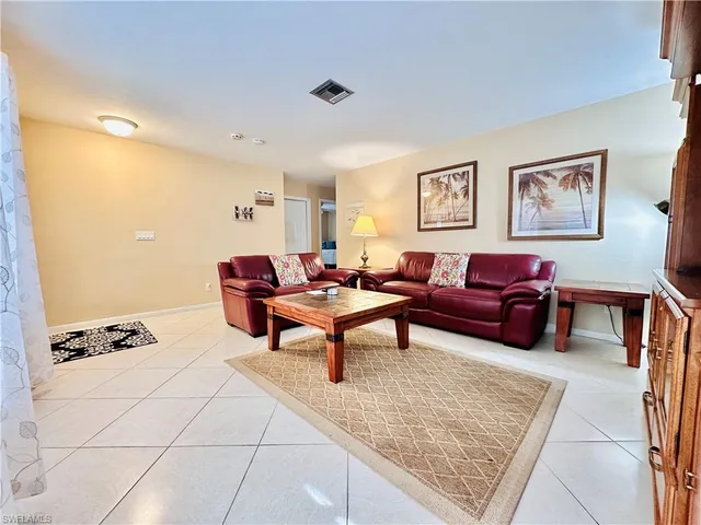 a living room with furniture and a couch