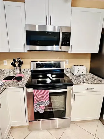 a kitchen with a stove and a microwave