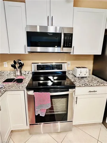 a kitchen with a stove and a microwave