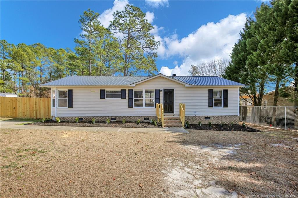 51 Old Forte Trail Spring Lake, NC 28390 - Photo 1 of 33 a view of a house with a yard and sitting area