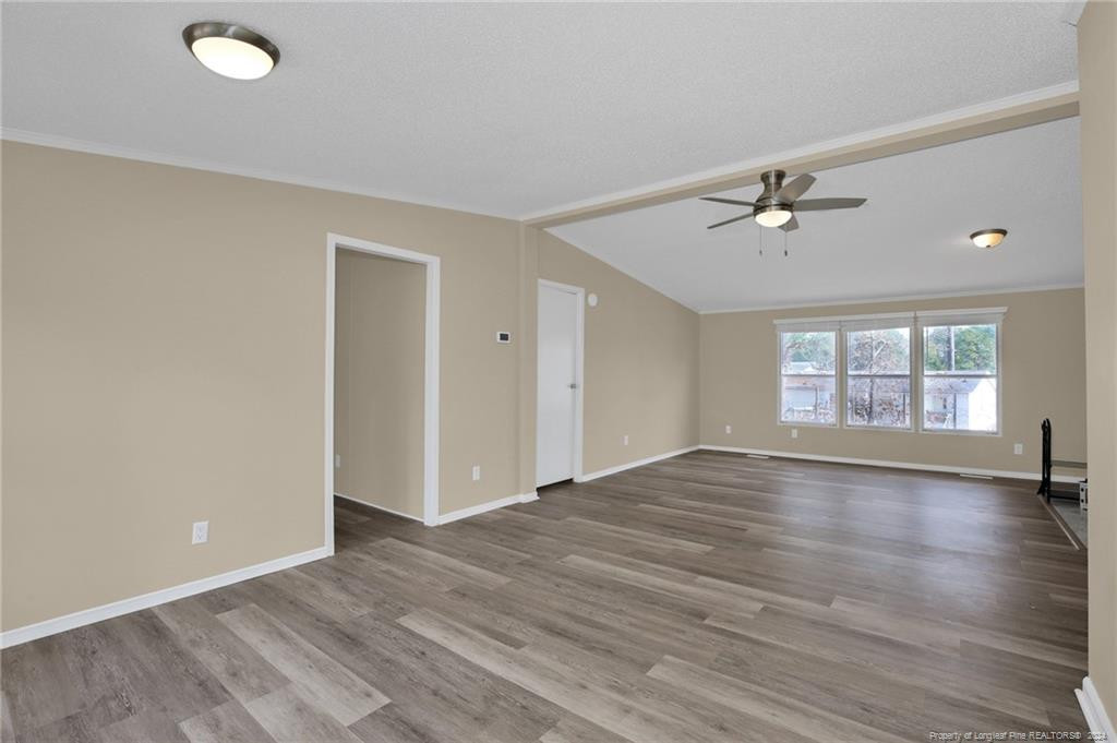 51 Old Forte Trail Spring Lake, NC 28390 - Photo 18 of 33 wooden floor in an empty room with a window