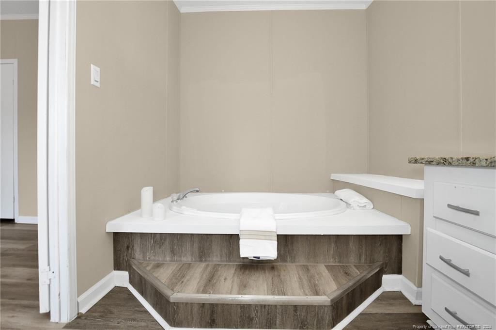 51 Old Forte Trail Spring Lake, NC 28390 - Photo 23 of 33 a bathroom with a sink and a mirror