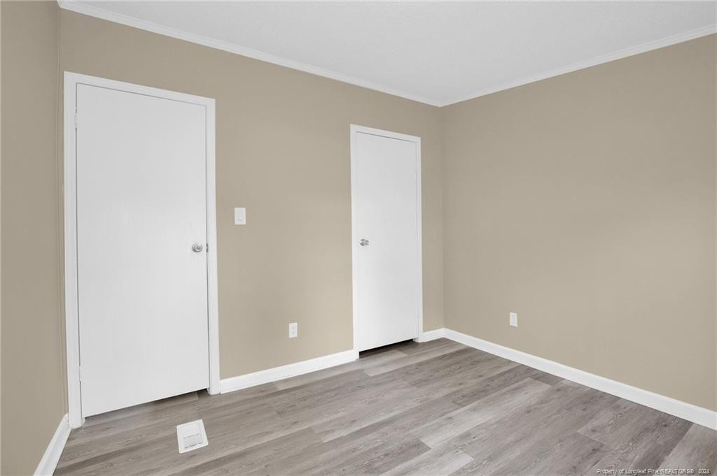 51 Old Forte Trail Spring Lake, NC 28390 - Photo 25 of 33 an empty room with wooden floor