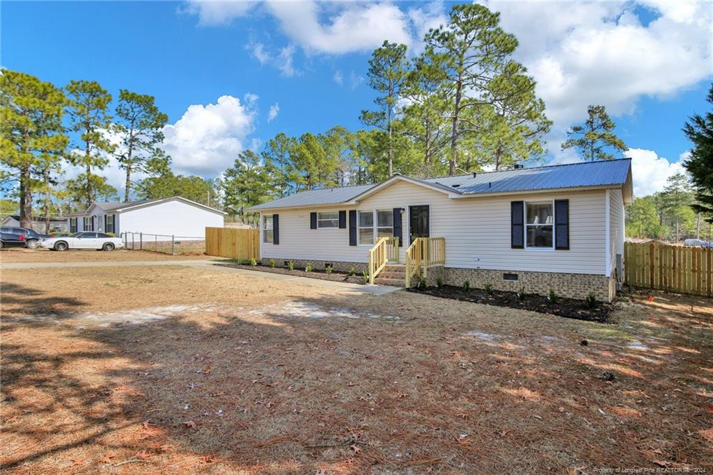 51 Old Forte Trail Spring Lake, NC 28390 - Photo 3 of 33 a view of a house with backyard and a tree