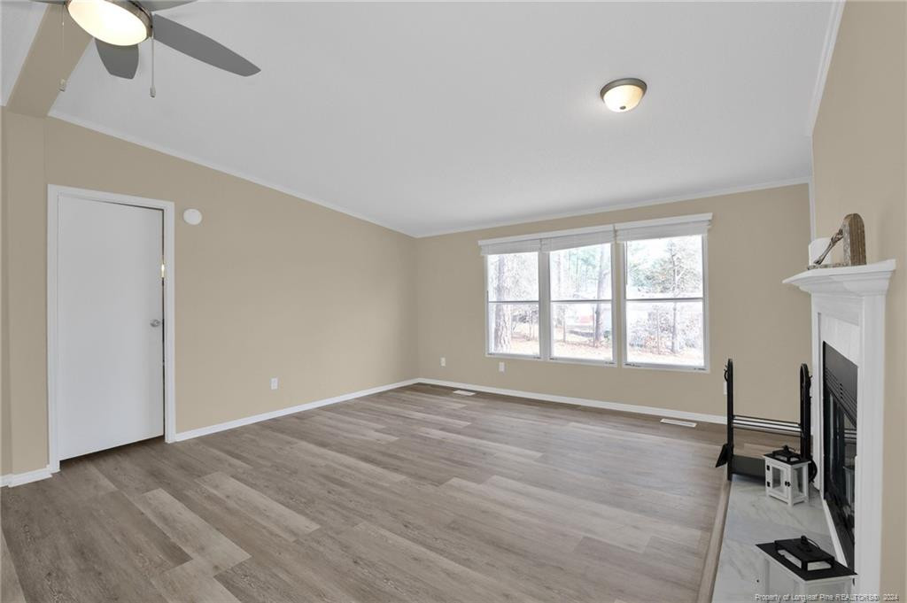 51 Old Forte Trail Spring Lake, NC 28390 - Photo 5 of 33 wooden floor in an empty room with a window