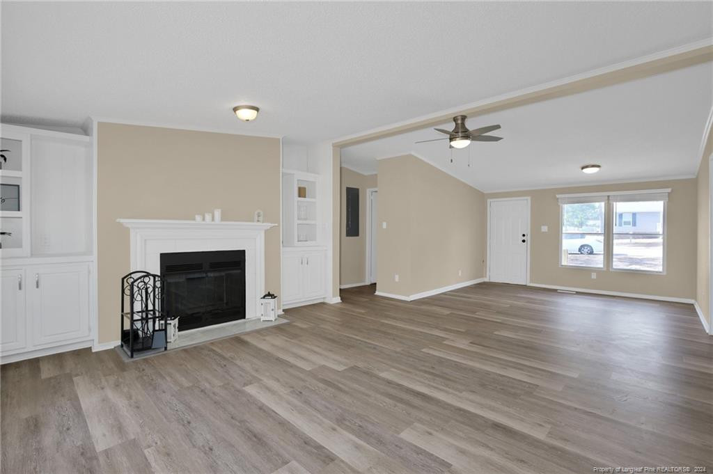 51 Old Forte Trail Spring Lake, NC 28390 - Photo 7 of 33 an empty room with windows and a fireplace