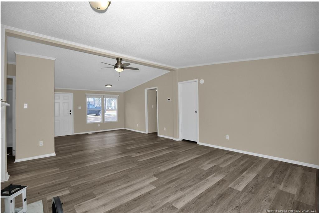 51 Old Forte Trail Spring Lake, NC 28390 - Photo 8 of 33 an empty room with wooden floor and windows