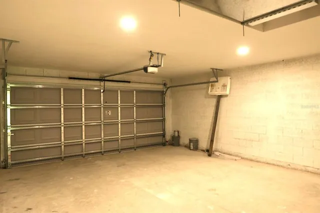 a view of an empty room with a garage