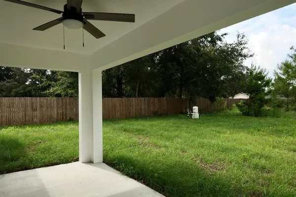 a backyard of a house with lots of green space