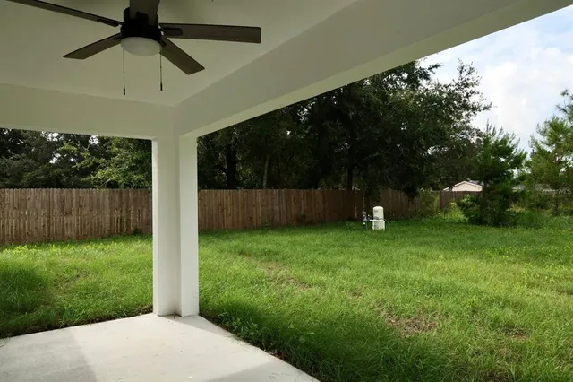 a backyard of a house with lots of green space