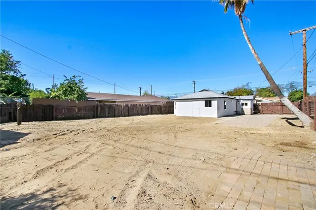 a view of a backyard of the house