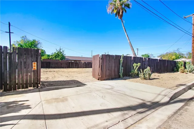 a street view with wooden fence and a fence