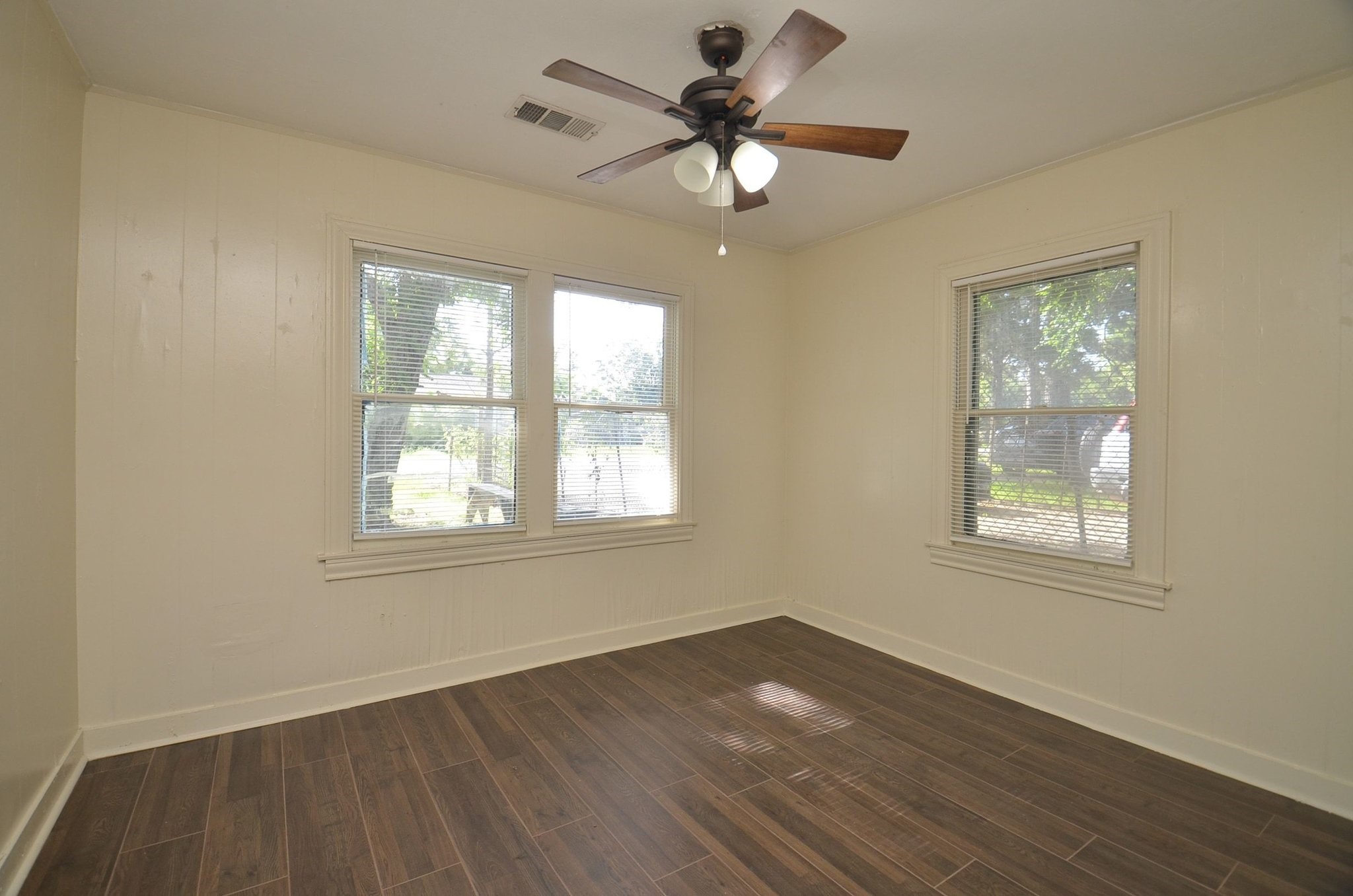 1600 5th Street Rosenberg, TX 77471 - Photo 18 of 24 Comfortable secondary bedroom with ample wall space.