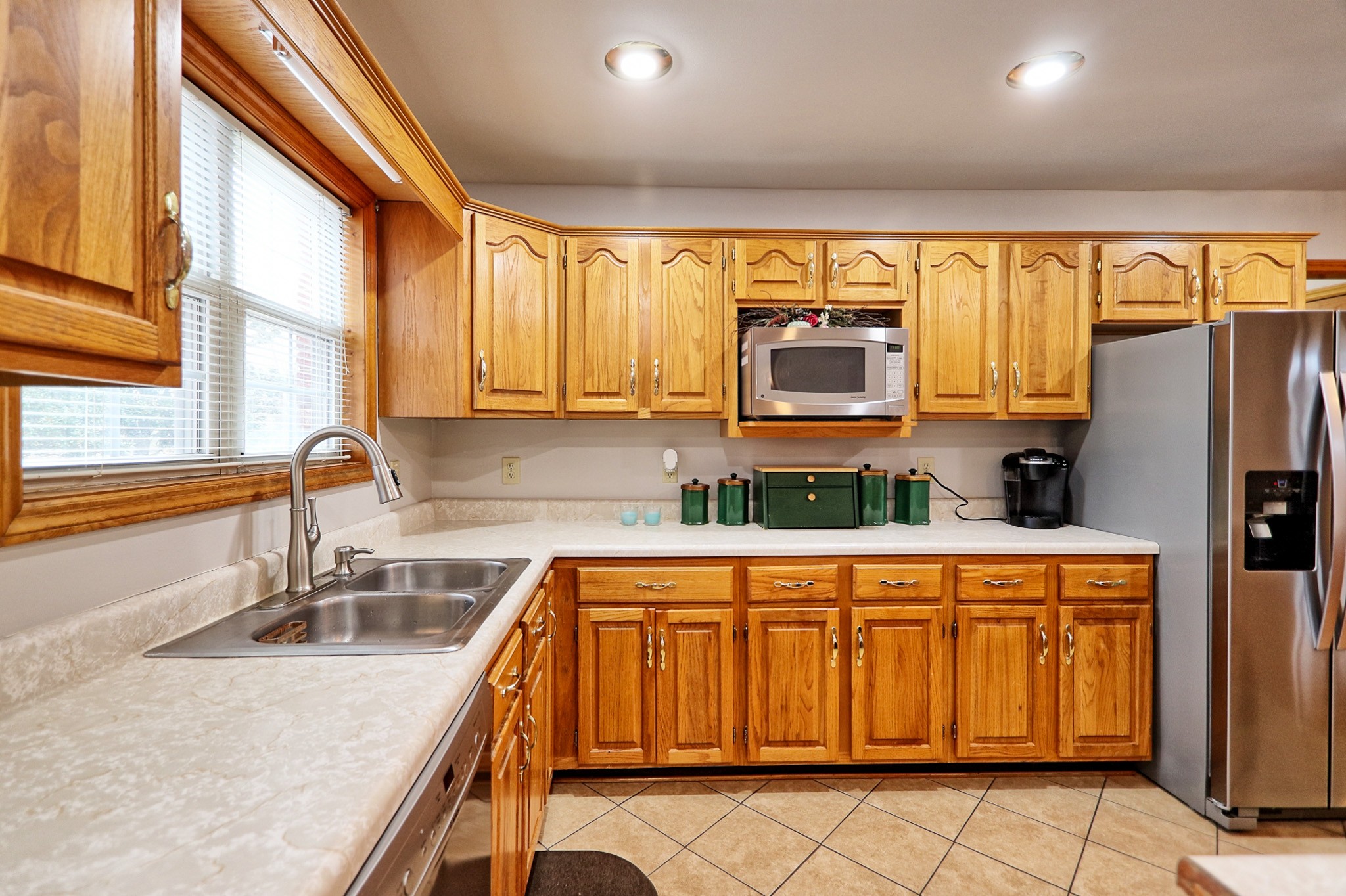 809 Nathan Drive Columbia, TN 38401 - Photo 16 of 41 a kitchen with stainless steel appliances granite countertop a refrigerator sink and cabinets